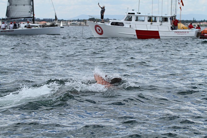 With no cardio work to be had on the course, one of Executive Decision's crewmembers got a bit of swimming in. - Club Marine Series ©  Alex McKinnon Photography http://www.alexmckinnonphotography.com